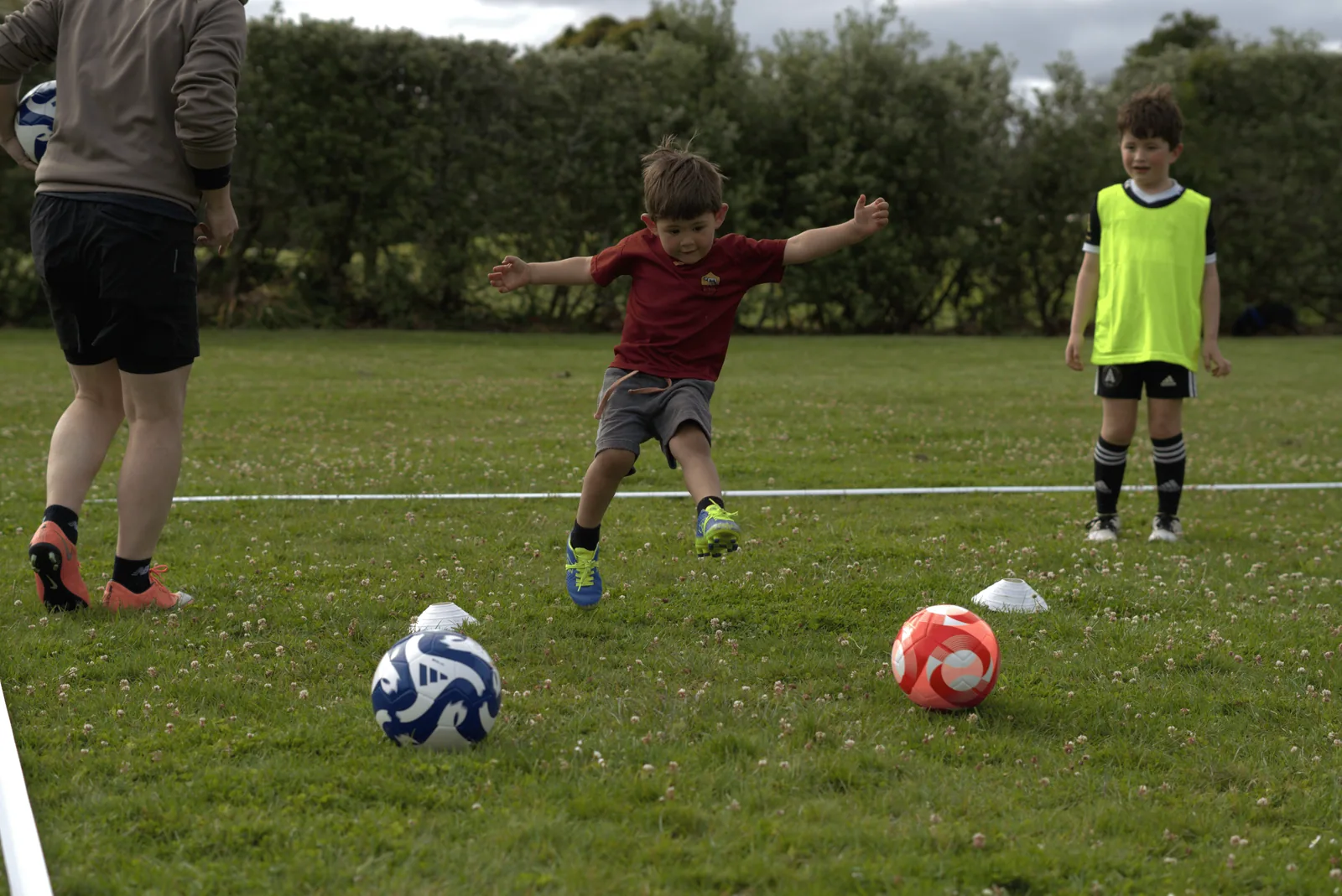 Young Patagonia FC player striking a football during outdoor training