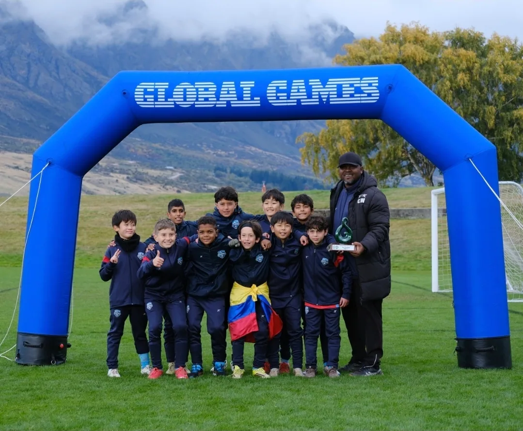 Patagonia FC U11 team celebrating with a trophy at the Global Games